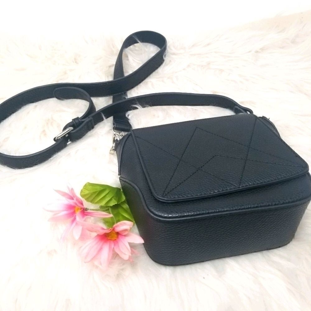 The Purse with a "C" tag inside.